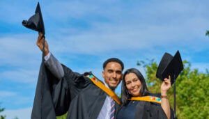 Gilberts as mother and son, Melissa and Calem Gilbert, summa cum laude, Graduates