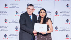 Doctoral Research Scholarship recipient, Ms Kelisha Pandaram (right), with UKZN Registrar, Mr Mark Tufts.
